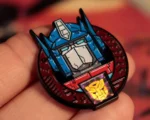 TRANSFORMERS - 40TH ANNIVERSARY - TWIN SET OF PIN BADGES - immagine 6